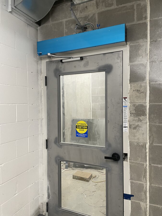 Automatic sliding door system for retail storefront